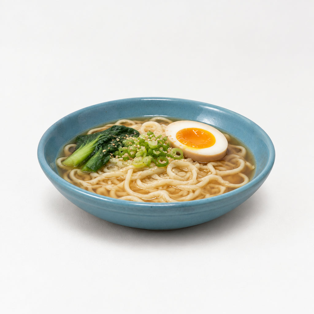 A small, round, shallow ceramic bowl or dish with a glossy finish.